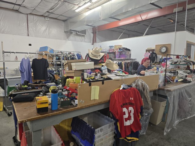 Volunteers sorting donated merchandise